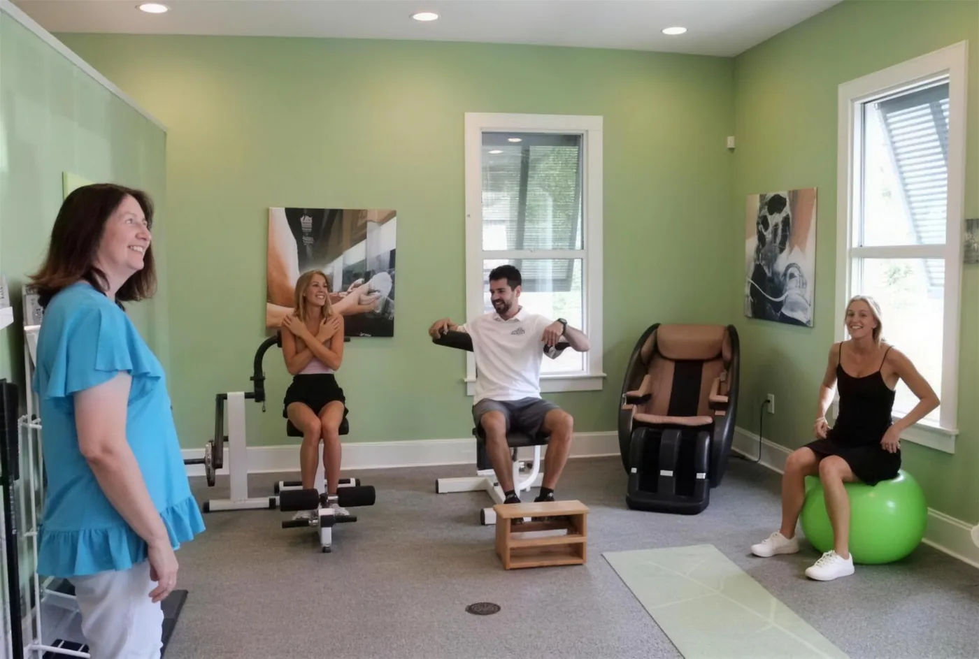 Patients working through exercises in the rehabilitation room at Strand Spine Institute